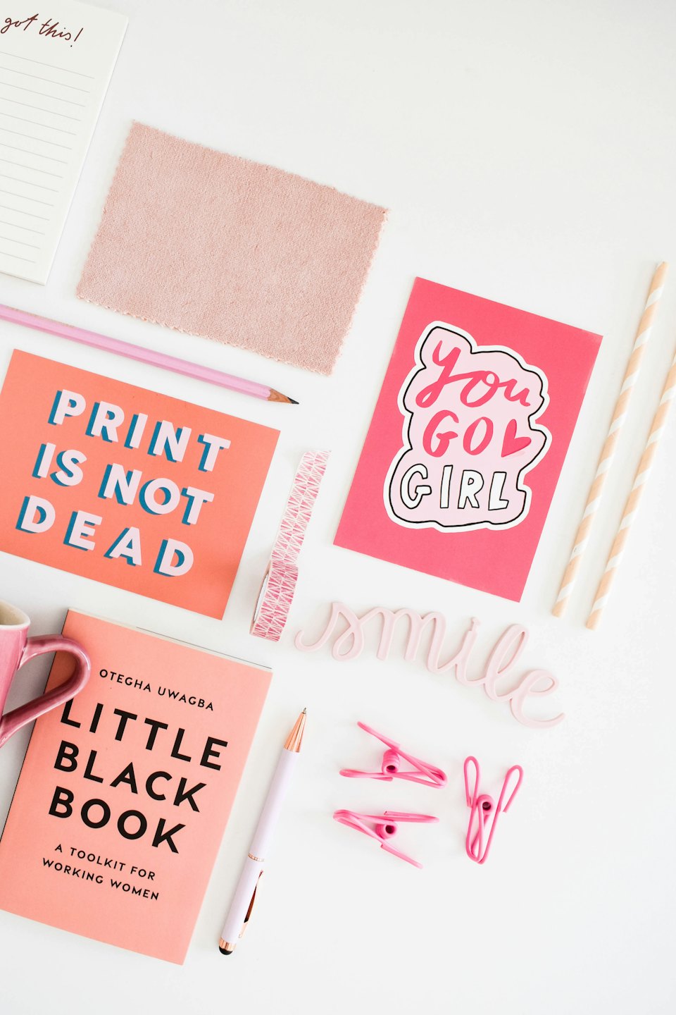 Creative stationery and office supplies arranged on a white surface.