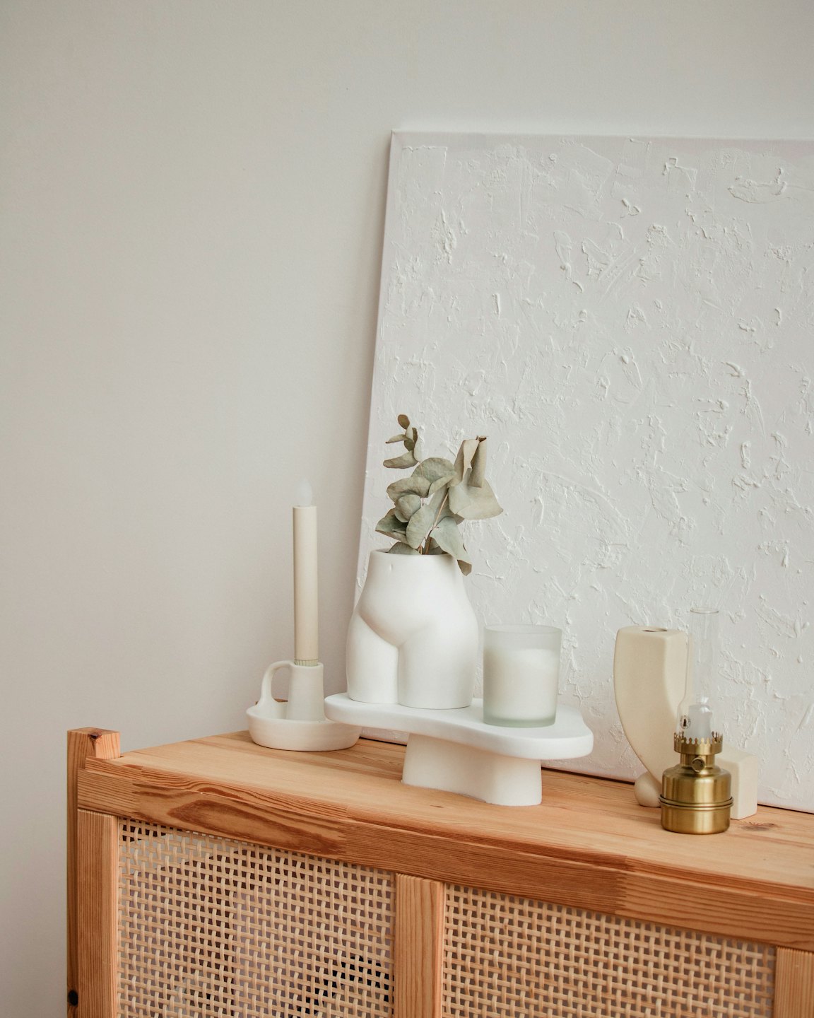 Minimalist home decor on a wooden cabinet.